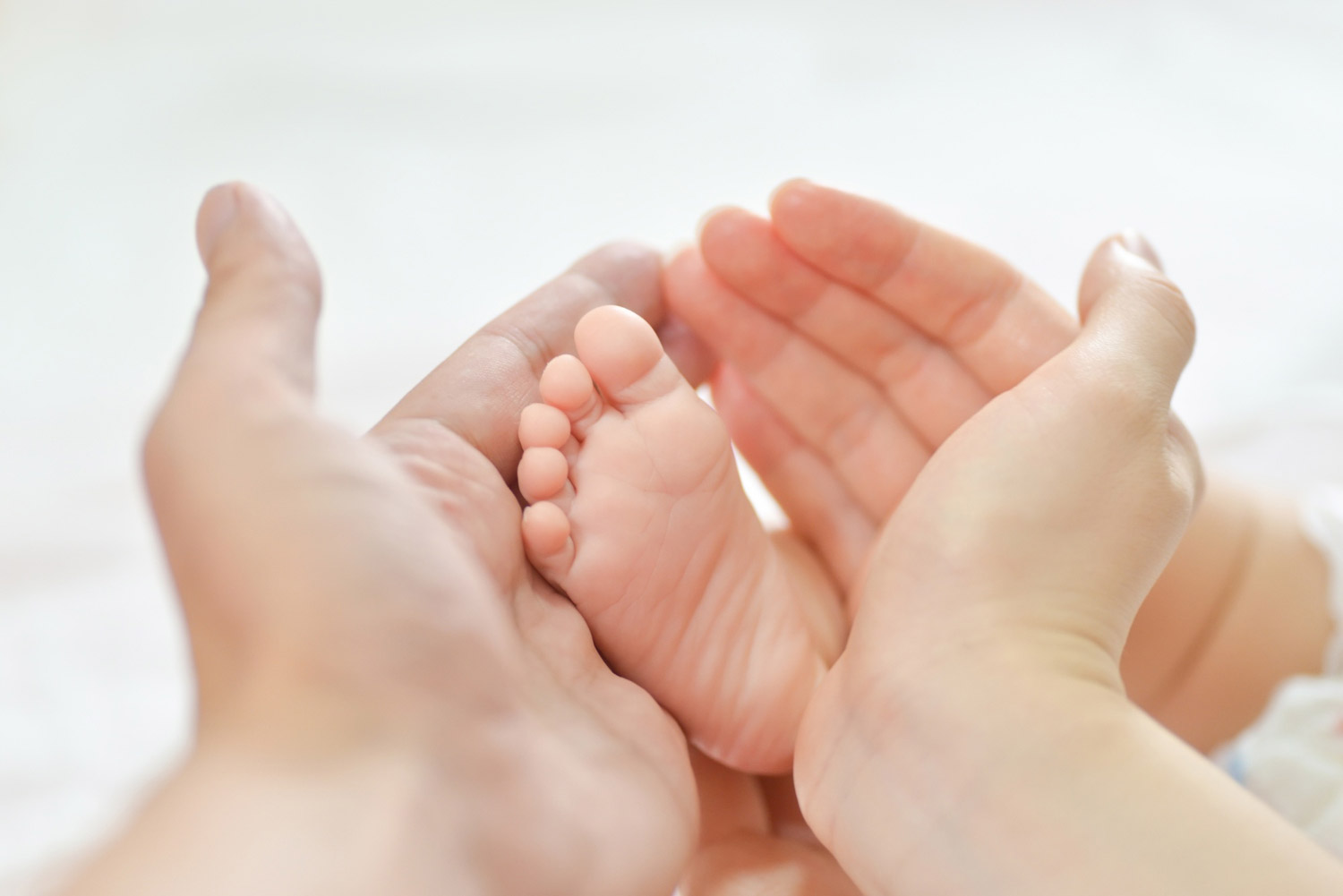baby-feet-mother-hands Home